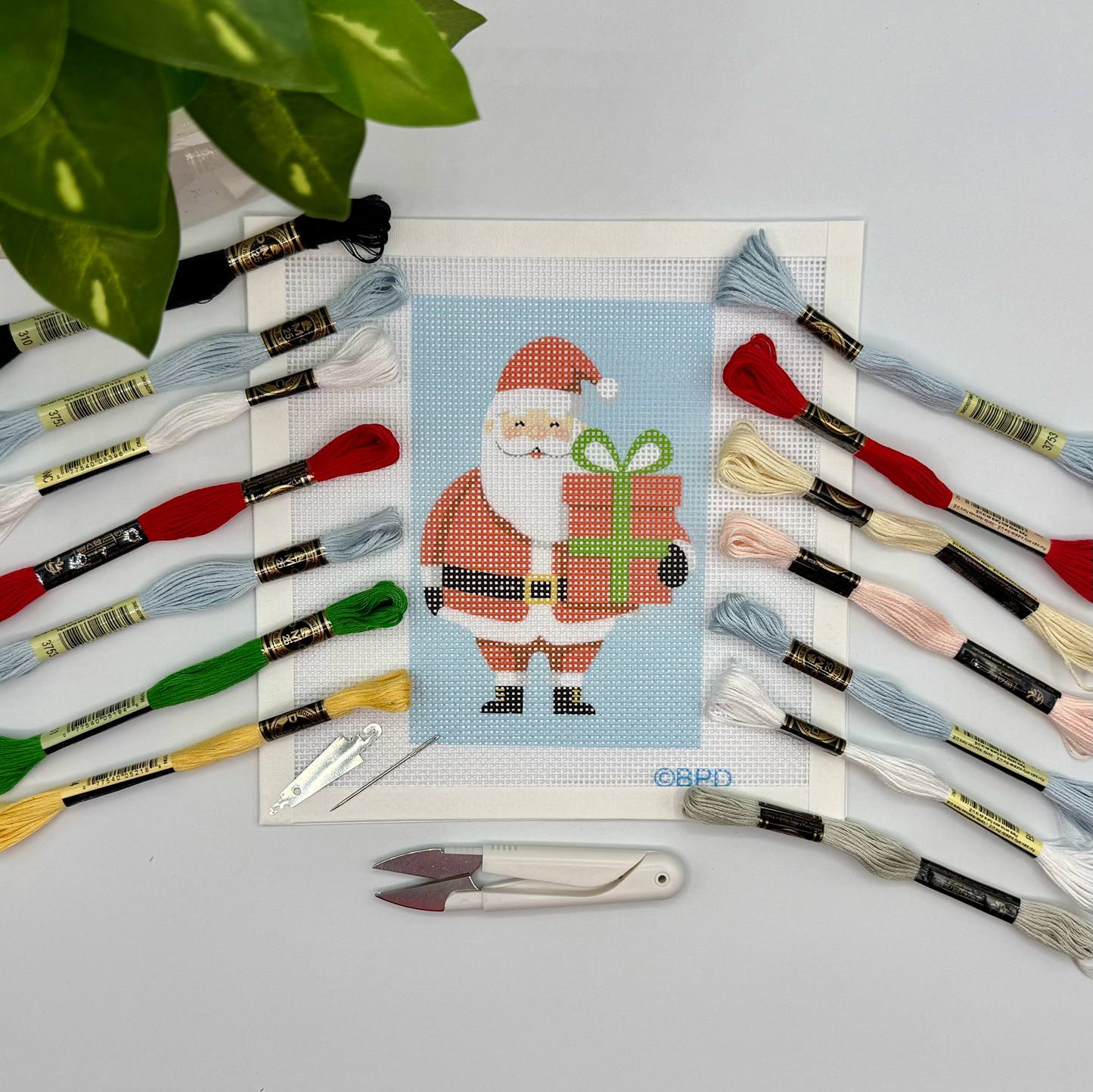 Christmas Santa Needlepoint Kit (holding present) needlepoint Blue Poppy Designs